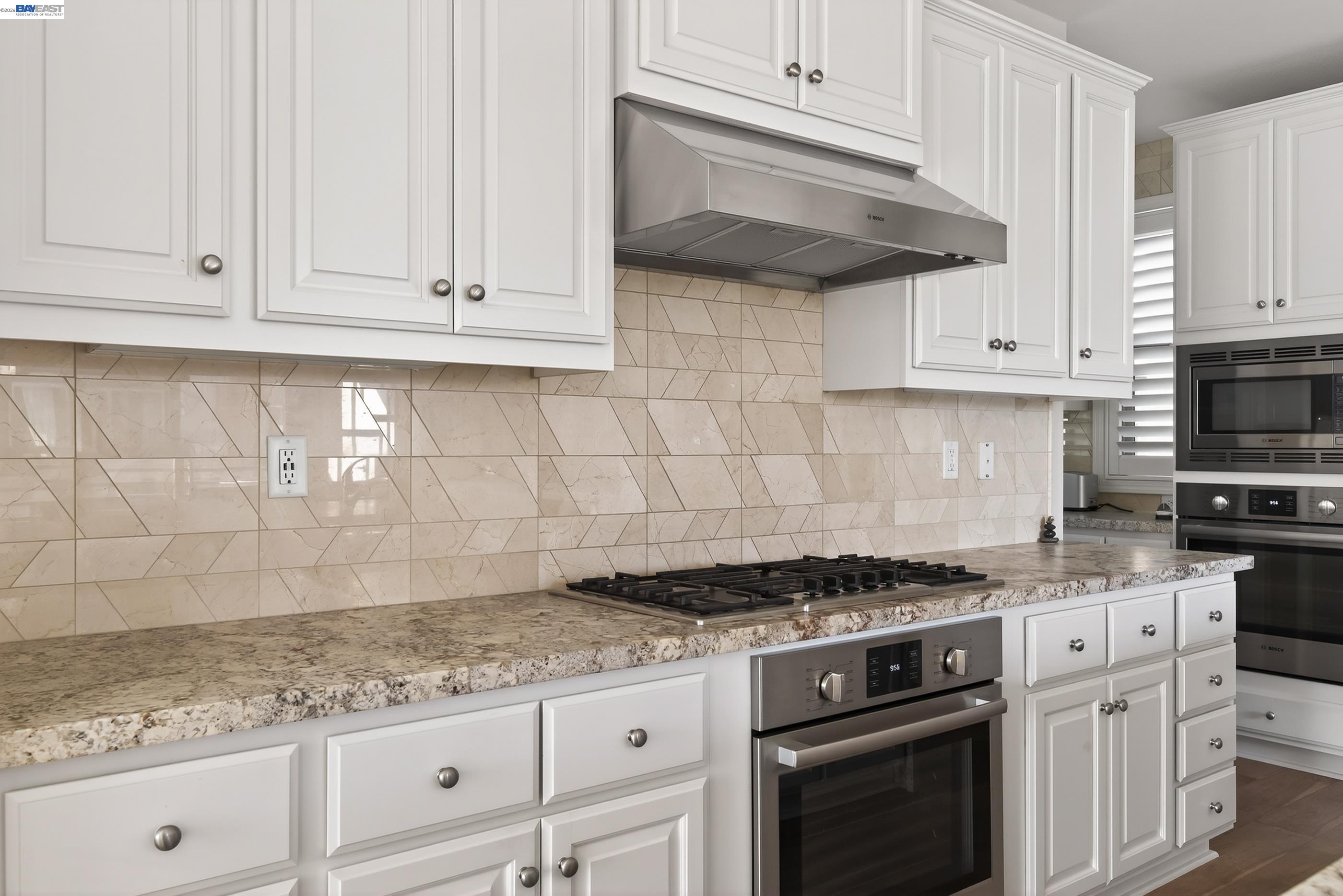 5531 Metropolitan Way Dublin, CA 94568 - Photo 6 of 56 a kitchen with granite countertop white cabinets and stainless steel appliances