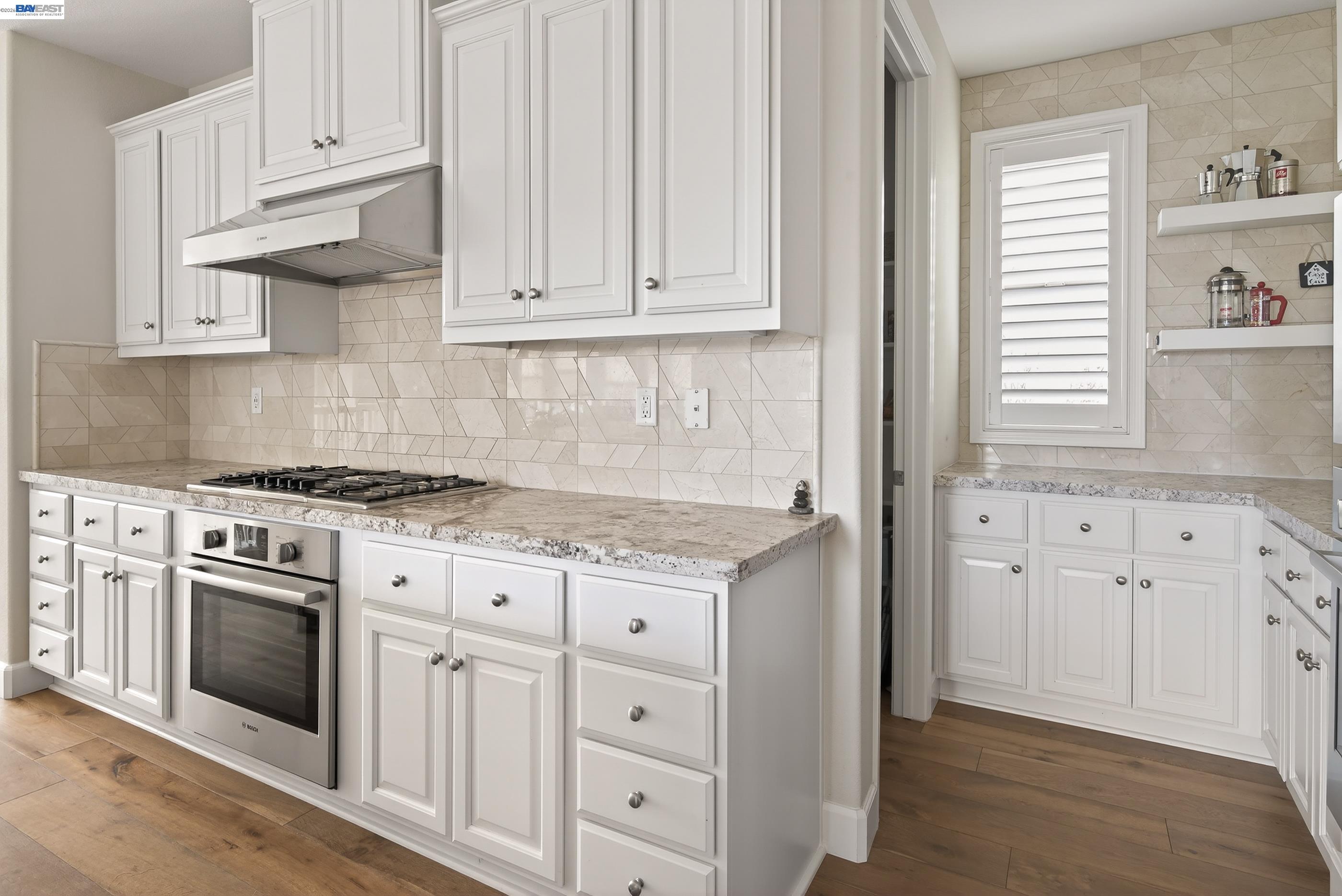 5531 Metropolitan Way Dublin, CA 94568 - Photo 9 of 56 a kitchen with granite countertop white cabinets and stainless steel appliances