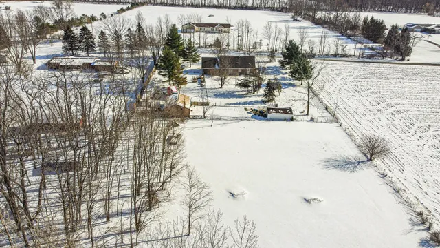 a view of a yard covered in snow