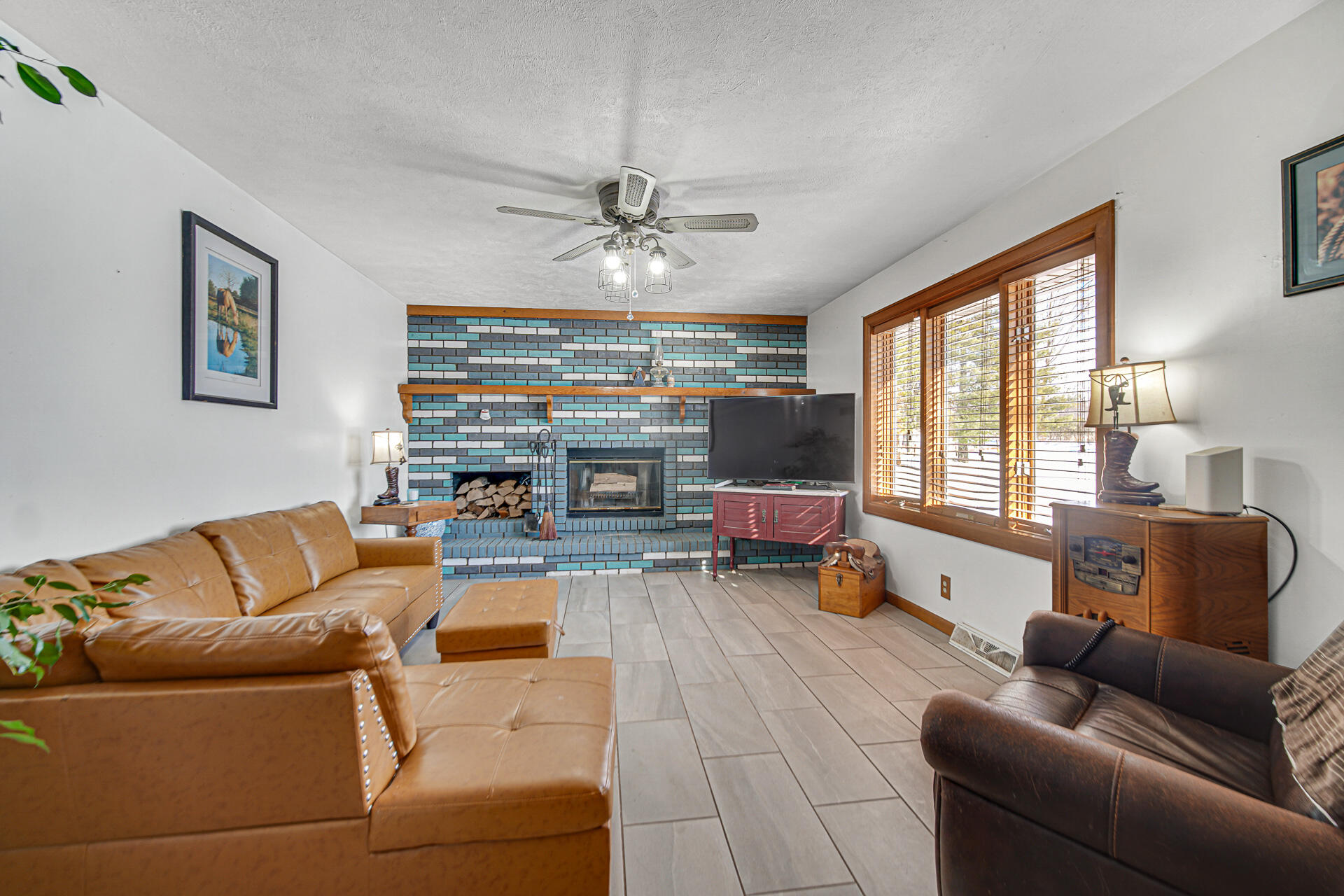 8524 North Wilhelm Road La Porte, IN 46350 - Photo 17 of 40 a living room with furniture ceiling fan and a large window