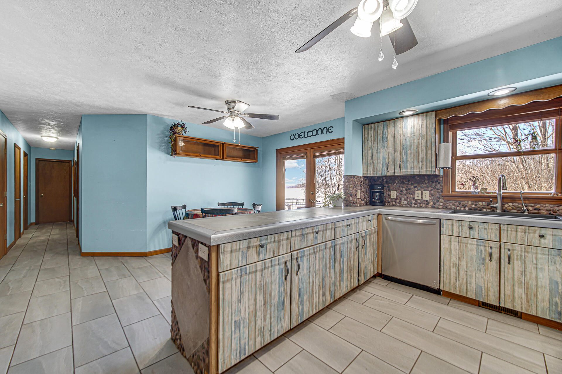8524 North Wilhelm Road La Porte, IN 46350 - Photo 21 of 40 a kitchen with stainless steel appliances granite countertop a stove and a sink