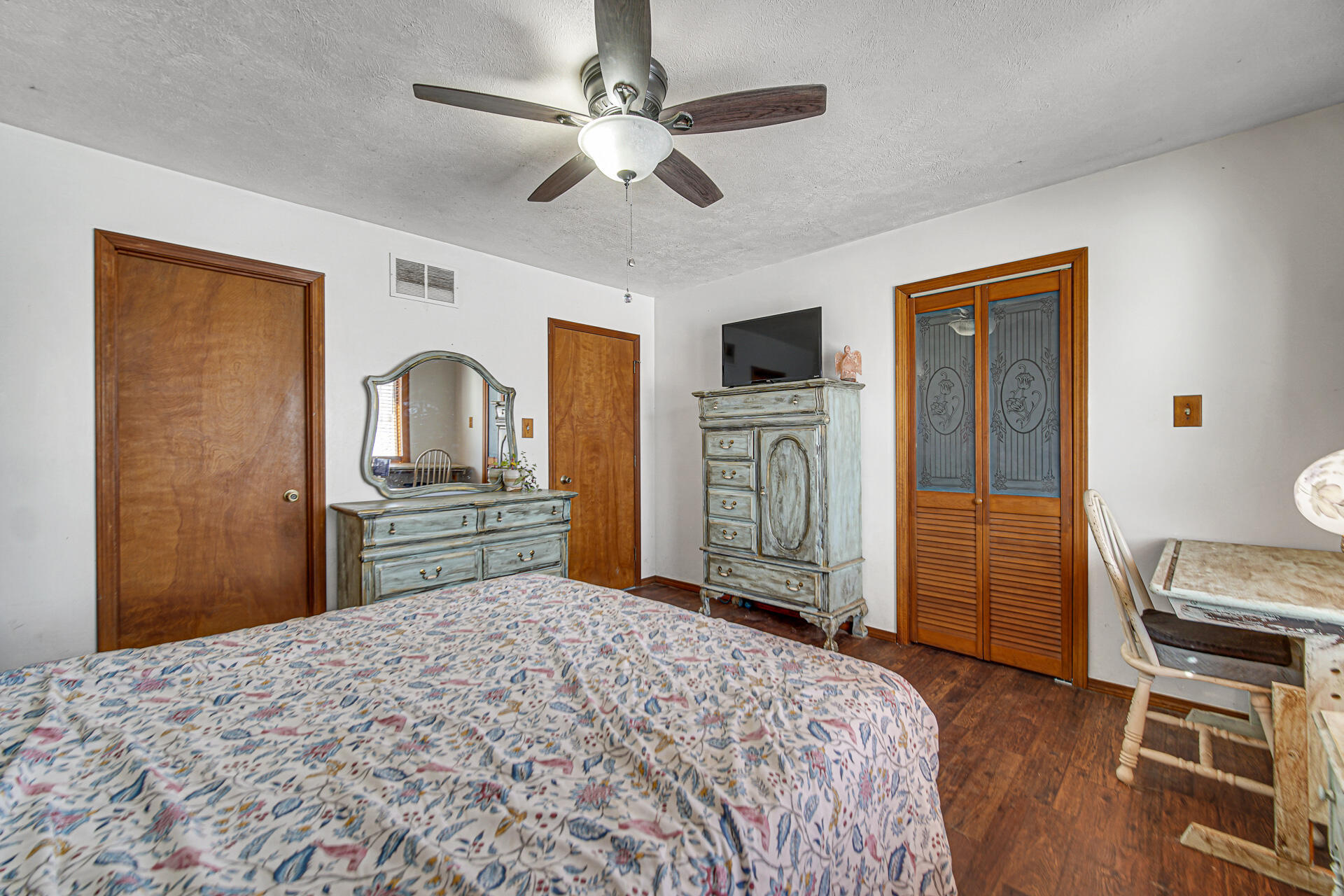 8524 North Wilhelm Road La Porte, IN 46350 - Photo 27 of 40 a bedroom with a bed dresser and a flat tv screen