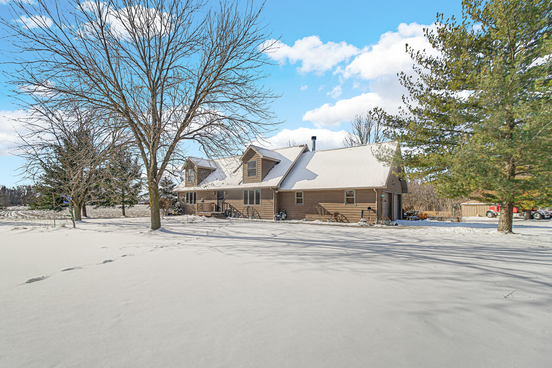 8524 North Wilhelm Road La Porte, IN 46350 - Photo 3 of 40 a view of a house with a snow in the yard