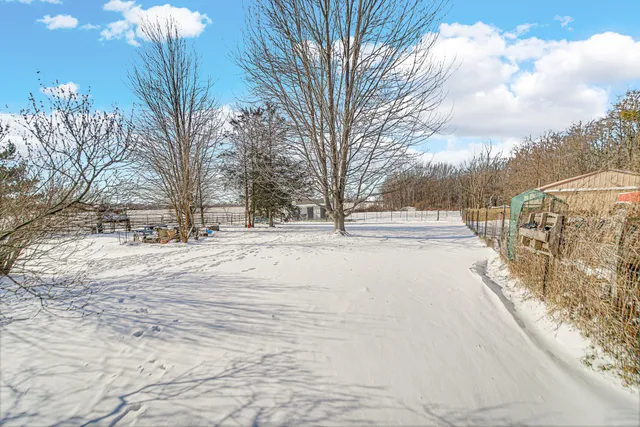 a view of road with snow on the road
