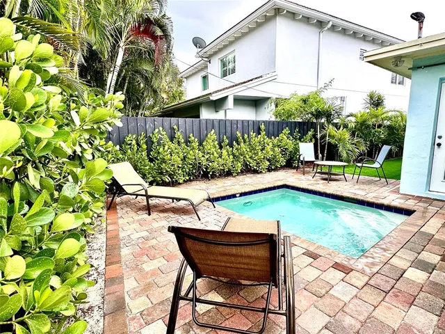 a view of a swimming pool with a patio