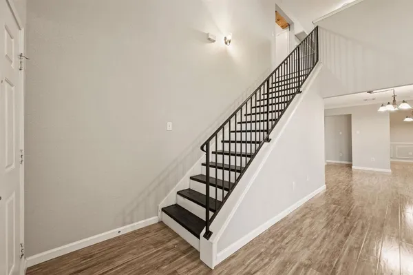 a view of entryway with wooden floor