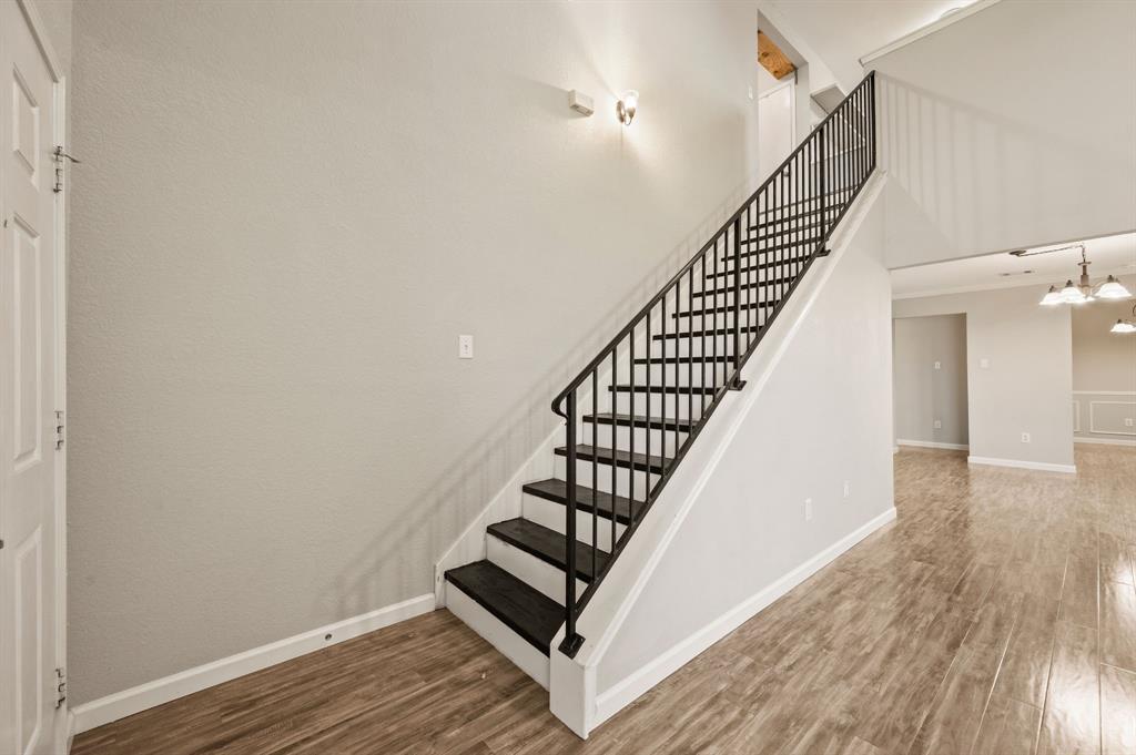 8713 Granite Path Fort Worth, TX 76244 - Photo 24 of 40 Entryway with staircase, updated flooring, and open sightlines into main living areas.