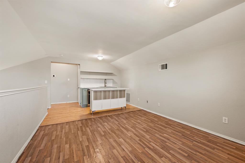 8713 Granite Path Fort Worth, TX 76244 - Photo 28 of 40 Expansive bonus room with sloped ceilings and abundant natural light.