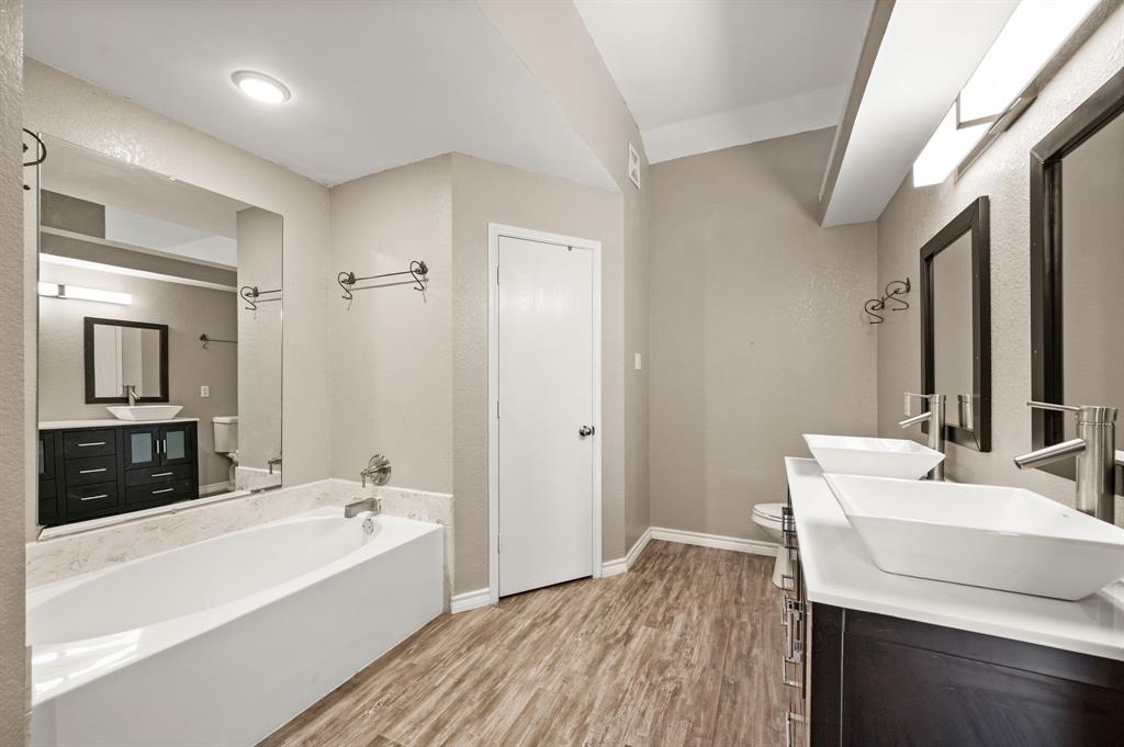 8713 Granite Path Fort Worth, TX 76244 - Photo 31 of 40 Bathroom featuring dual vessel sinks, modern vanity, and updated lighting.