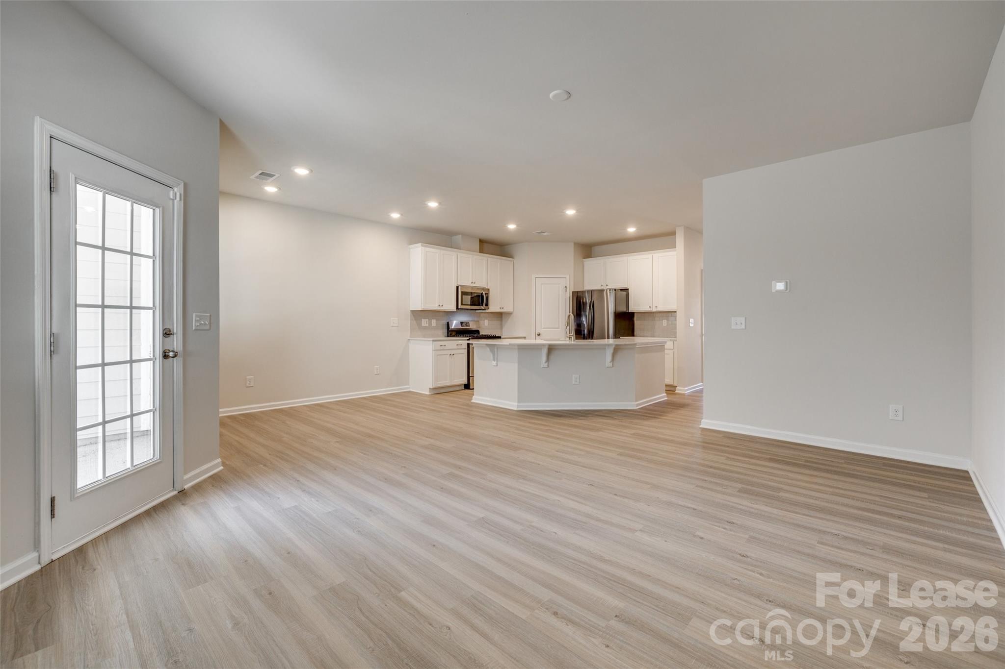 807 Gable Oak Lane Fort Mill, SC 29708 - Photo 13 of 39 a view of large kitchen with wooden floor and windows