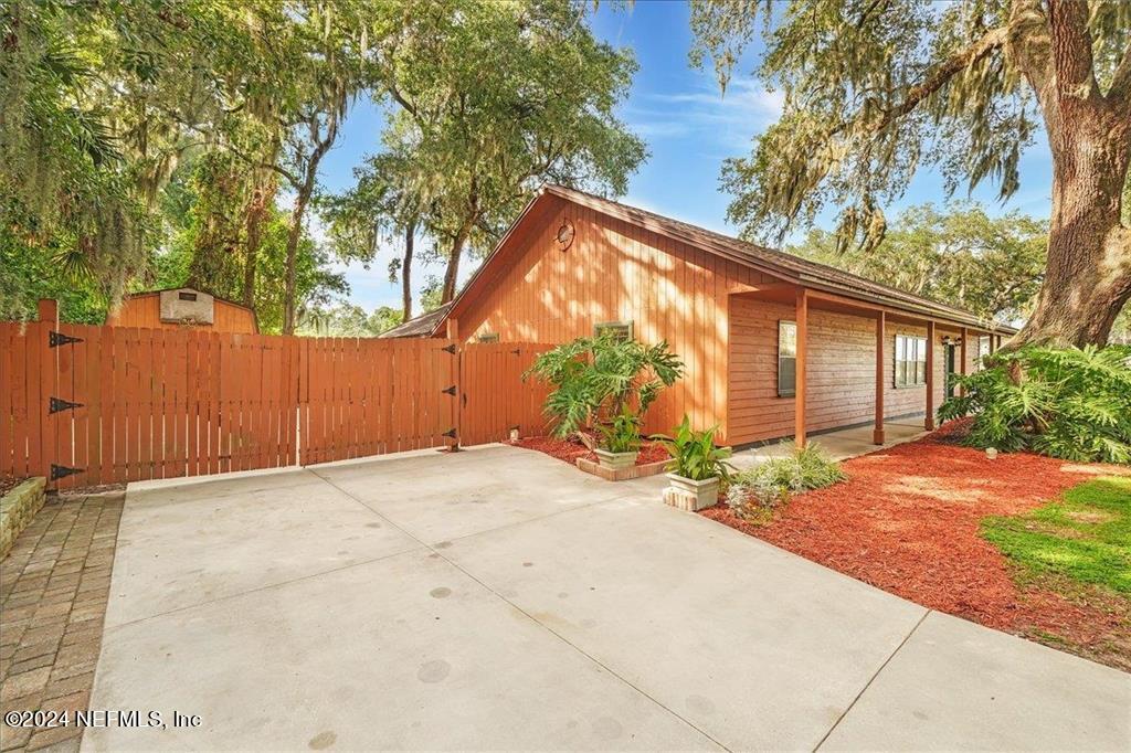 123 Unicorn Road St. Augustine, FL 32086 - Photo 1 of 51 a backyard of a house