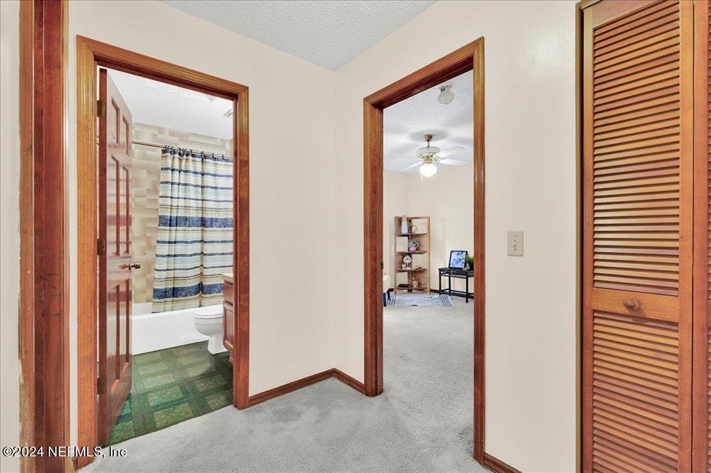 123 Unicorn Road St. Augustine, FL 32086 - Photo 15 of 51 a view of a livingroom from a hallway