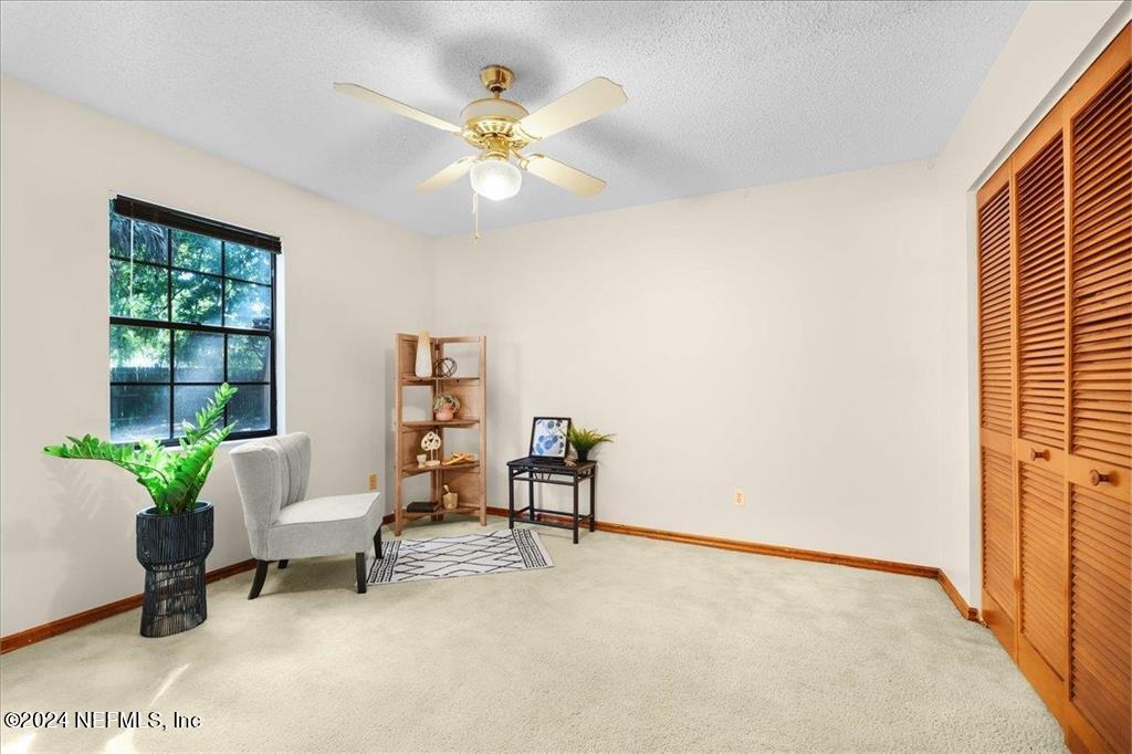 123 Unicorn Road St. Augustine, FL 32086 - Photo 16 of 51 a view of a livingroom with furniture and a potted plant