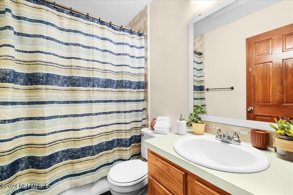 123 Unicorn Road St. Augustine, FL 32086 - Photo 18 of 51 a bathroom with a sink and a mirror