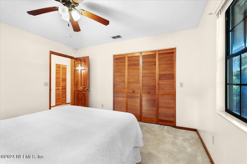 123 Unicorn Road St. Augustine, FL 32086 - Photo 20 of 51 a bedroom with a bed and a window