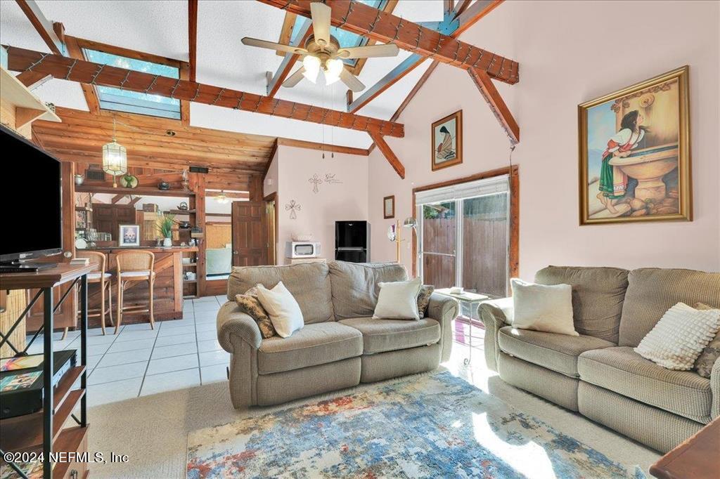 123 Unicorn Road St. Augustine, FL 32086 - Photo 24 of 51 a living room with furniture a flat screen tv and a window