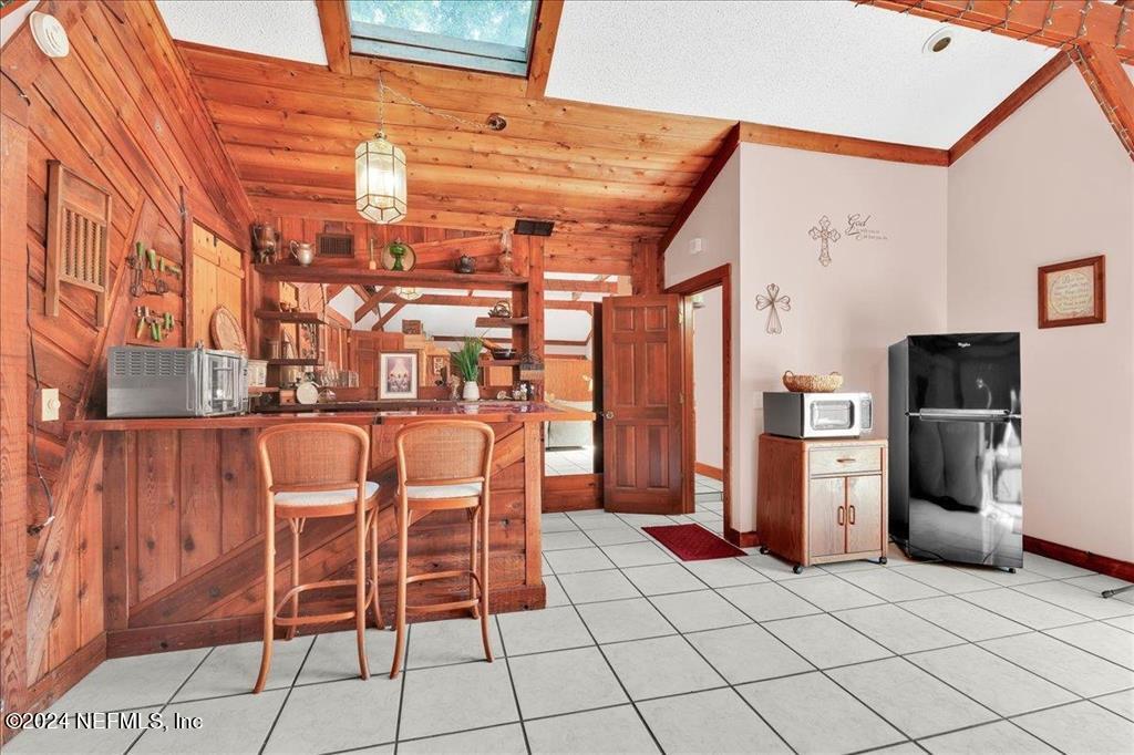 123 Unicorn Road St. Augustine, FL 32086 - Photo 25 of 51 a dining room with furniture and stainless steel appliances