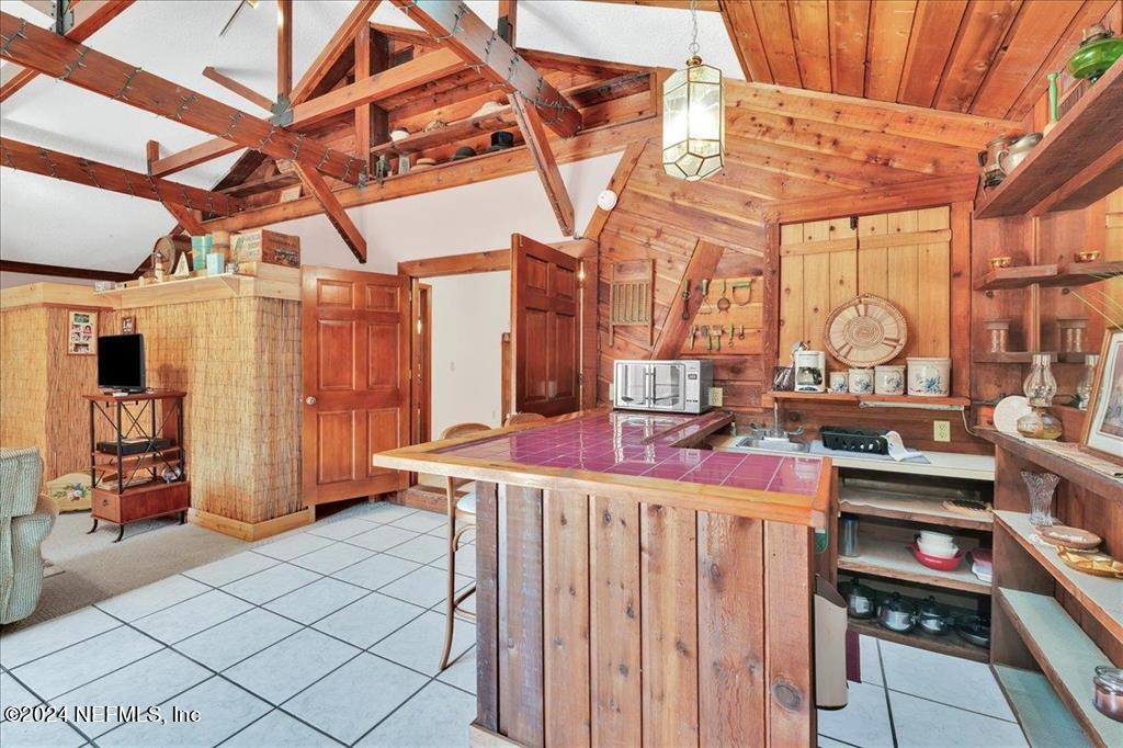 123 Unicorn Road St. Augustine, FL 32086 - Photo 28 of 51 a room with lots of wooden furniture and a windows