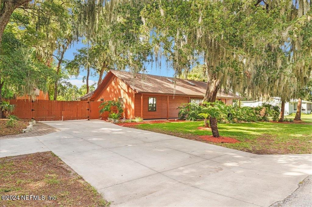 123 Unicorn Road St. Augustine, FL 32086 - Photo 40 of 51 a view of a park with large trees