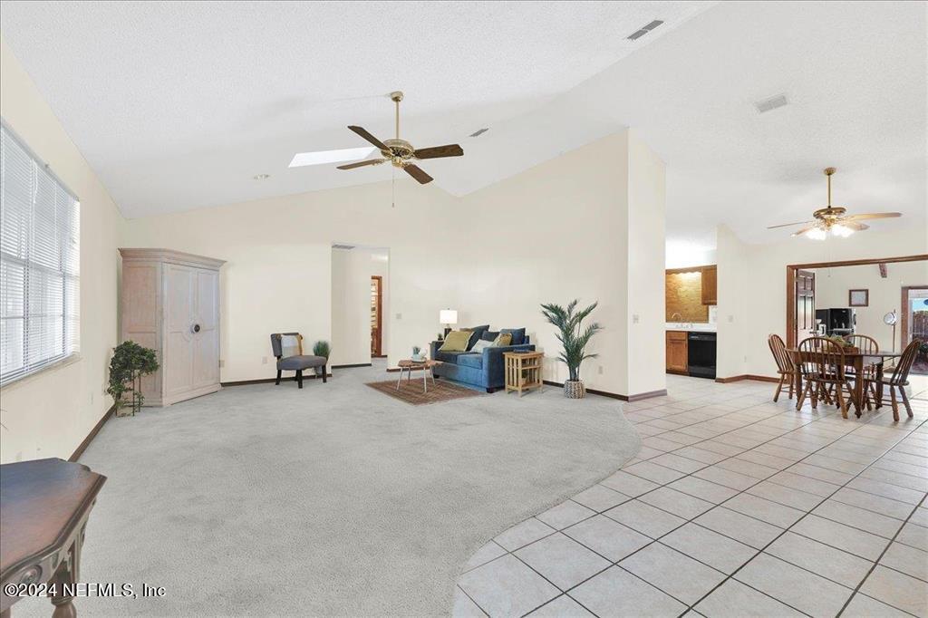 123 Unicorn Road St. Augustine, FL 32086 - Photo 4 of 51 a view of a livingroom with furniture and a ceiling fan
