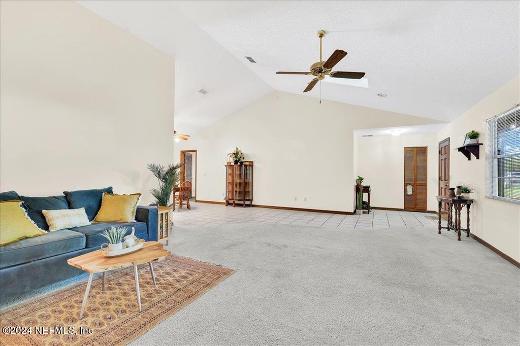 123 Unicorn Road St. Augustine, FL 32086 - Photo 5 of 51 a living room with furniture and a table