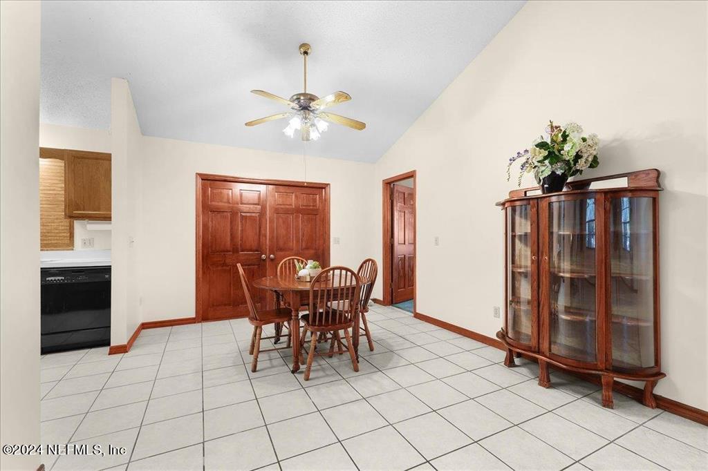 123 Unicorn Road St. Augustine, FL 32086 - Photo 9 of 51 a view of a dining room with furniture and chandelier