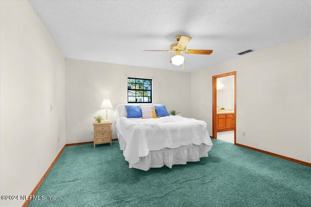 123 Unicorn Road St. Augustine, FL 32086 - Photo 10 of 51 a bedroom with a bed and a window