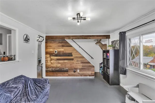 a view of a hallway with windows and stairs