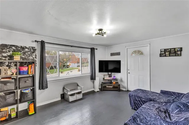 a bedroom with furniture and a window