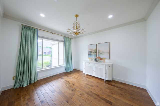 868 Braddock Lane Alpine, UT 84004 - Photo 13 of 64 Spacious room featuring wood-finish flooring and a contemporary chandelier