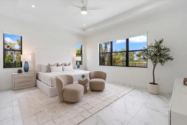 a spacious bedroom with a bed and a couch