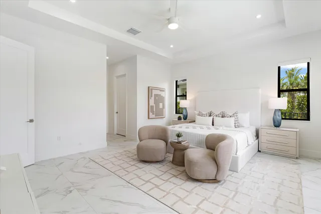 a living room with furniture and white walls