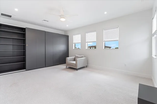 a room with a cabinet and a window