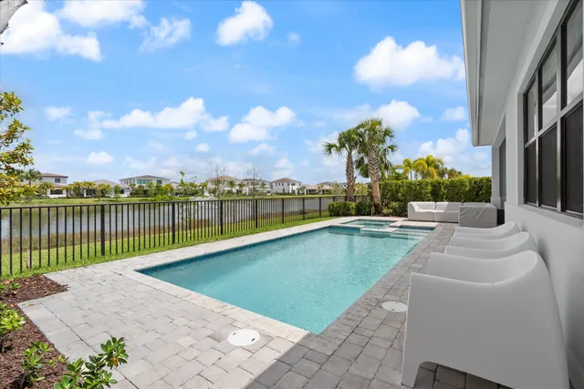 a view of a swimming pool with a lounge chairs