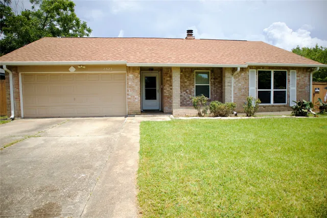 a front view of a house with a garden and porch