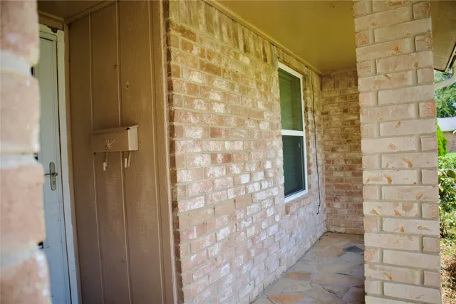 a view of front door and yard