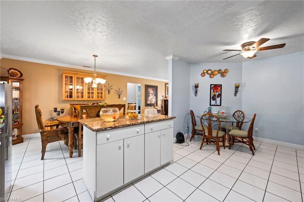 2285 50th Street Southwest Naples, FL 34116 - Photo 12 of 29 Kitchen island and dining areas