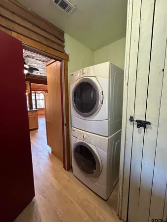a view of a hallway with washer and dryer