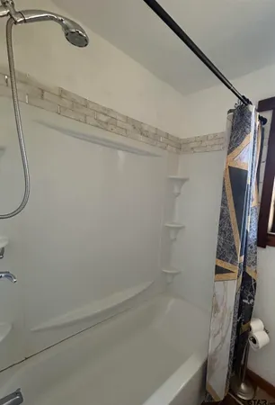 a bathroom with a bathtub