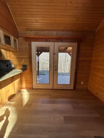 a view of a room with wooden walls