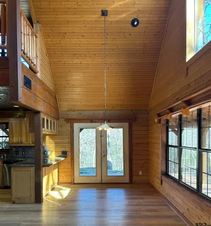 a view of a balcony with wooden floor