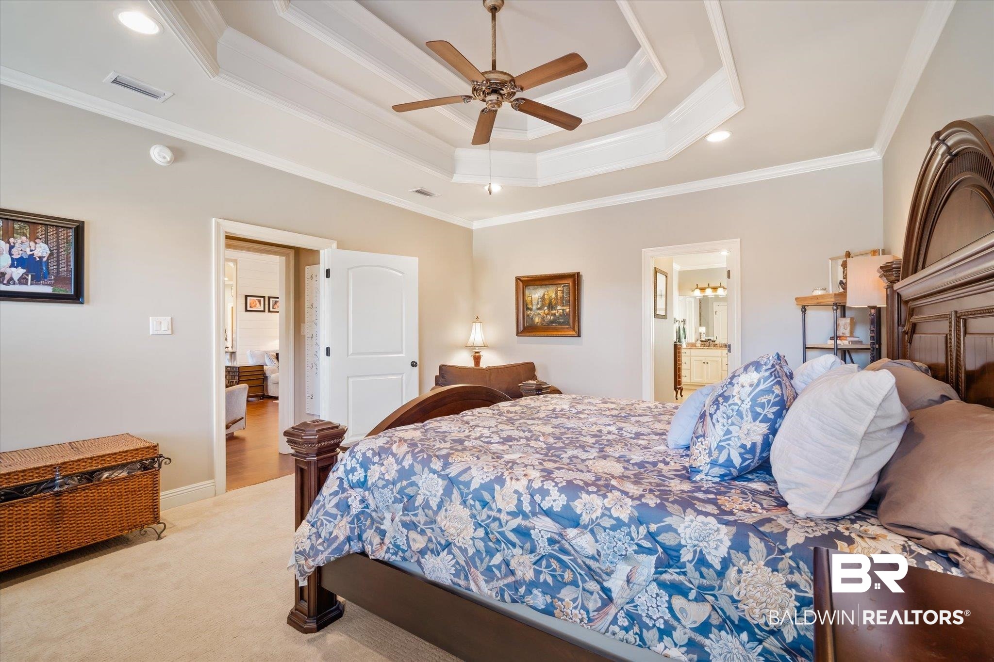 5683 Spring Landing Drive Theodore, AL 36582 - Photo 16 of 49 Carpeted bedroom with ornamental molding, a raised ceiling, connected bathroom, and ceiling fan