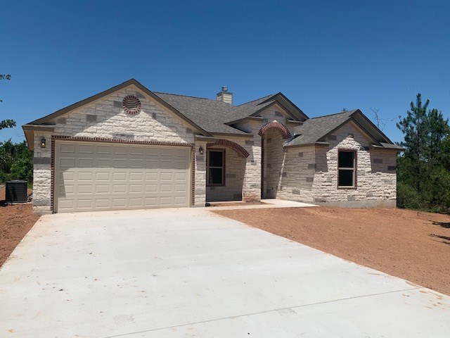 a front view of a house with yard