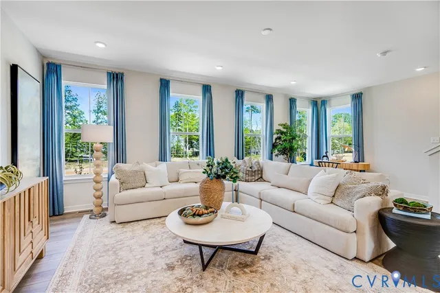 a living room with furniture and a large window