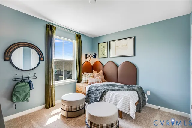 a bedroom with a bed and a mirror