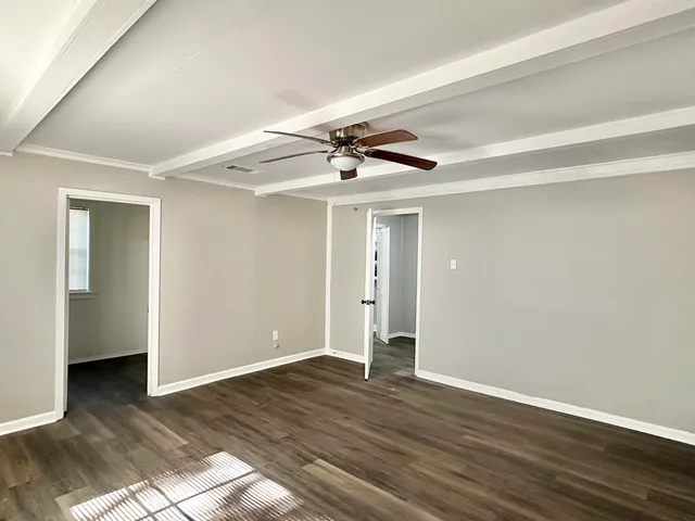 a view of a livingroom with wooden floor