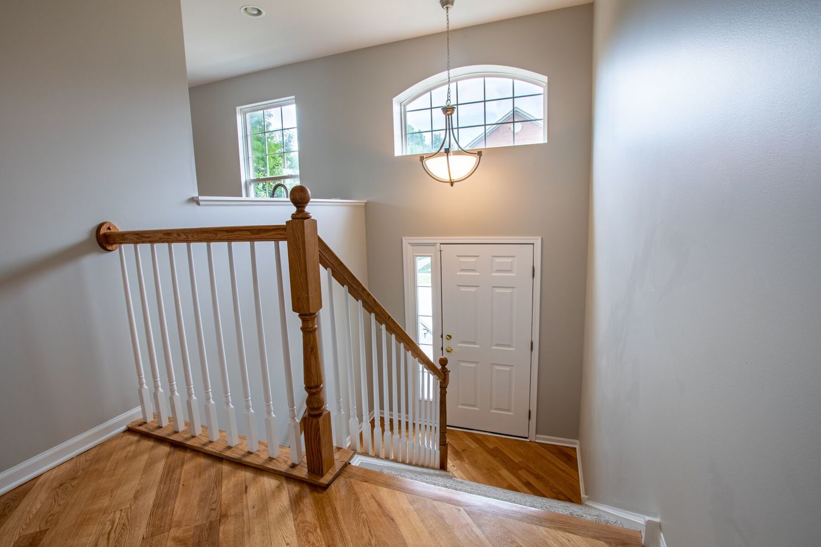 4125 Bethlehem Road Aurora, IL 60504 - Photo 2 of 19 an empty room with wooden floor chandelier and windows
