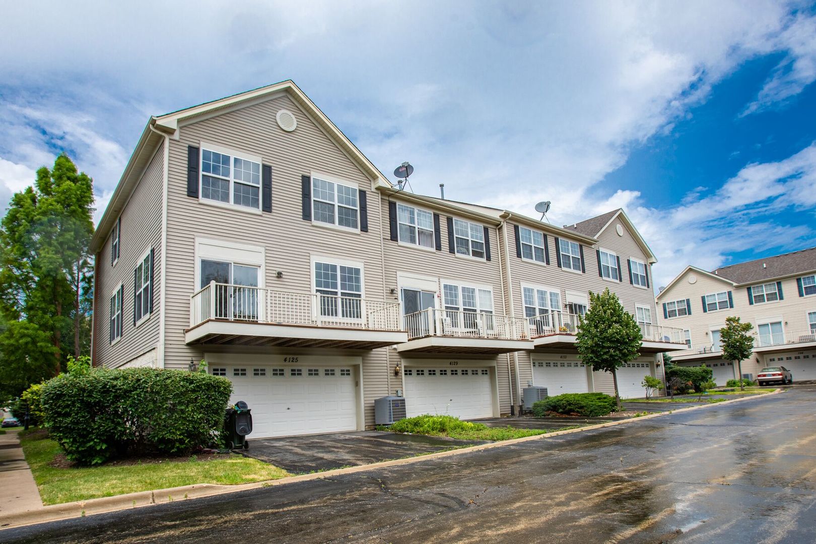 4125 Bethlehem Road Aurora, IL 60504 - Photo 19 of 19 a front view of a residential apartment building with a yard