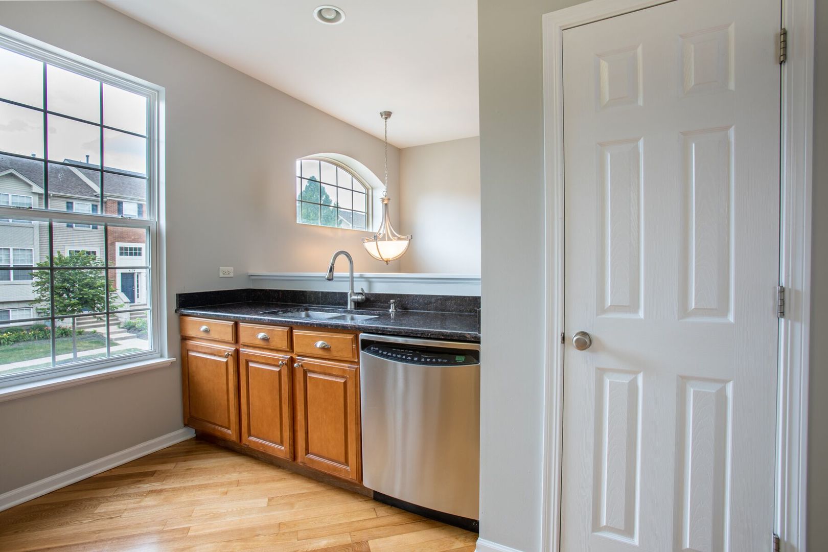 4125 Bethlehem Road Aurora, IL 60504 - Photo 4 of 19 a kitchen with stainless steel appliances granite countertop a stove a sink and a granite counter tops with a large window