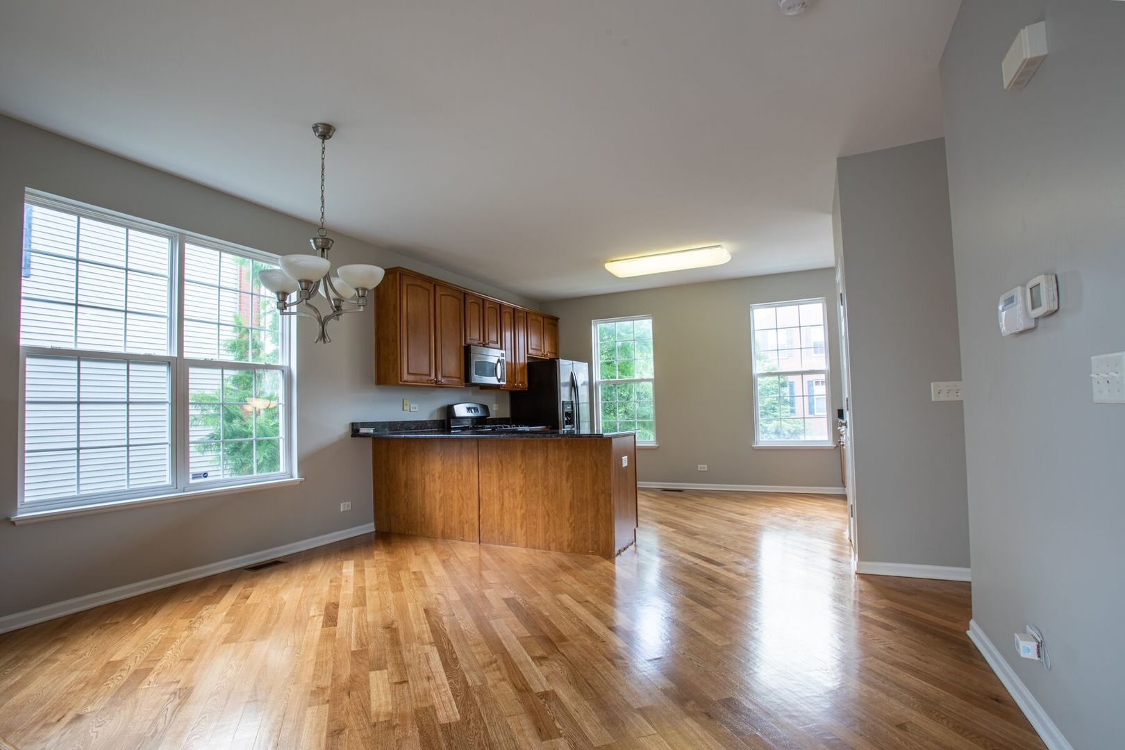 4125 Bethlehem Road Aurora, IL 60504 - Photo 5 of 19 a view of empty room with wooden floor and a window